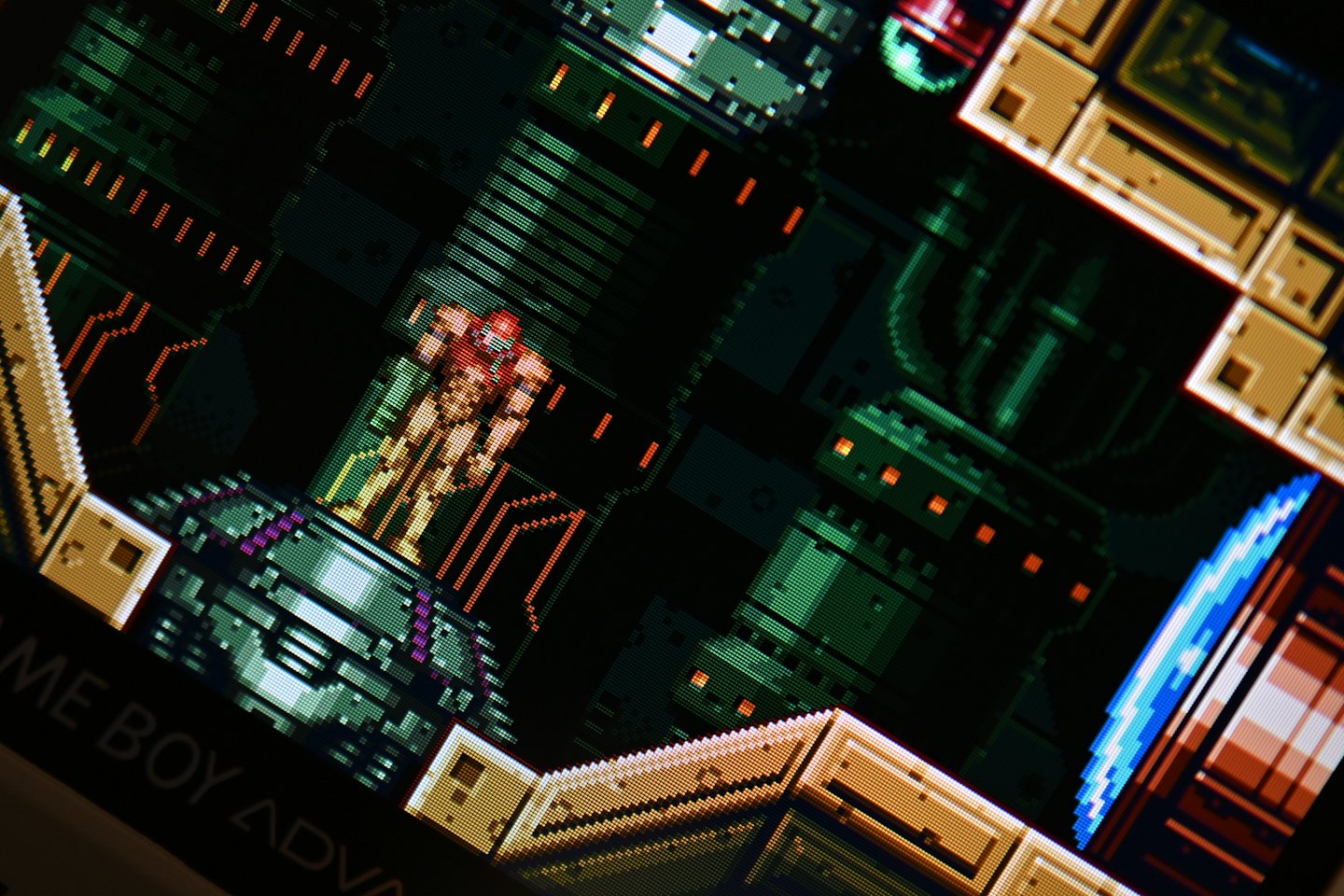Retro pixel art video game on portable console screen.
